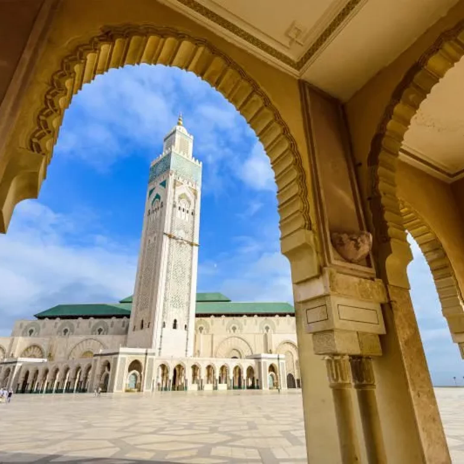 1. A stunning view of the Hassan II Mosque in Casablanca, Morocco, showcasing its intricate architecture and coastal setting while your 16-day Morocco luxury tour from Casablanca